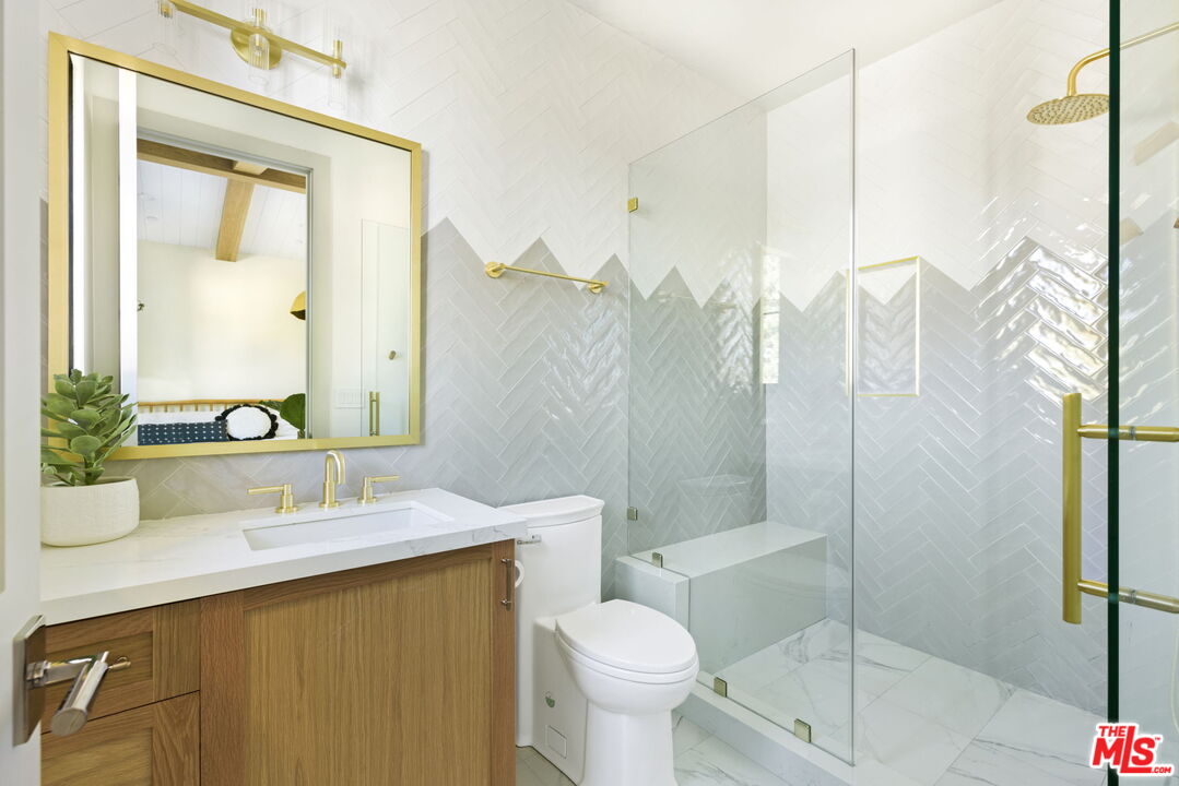 6310 Mirror Lake Drive Los Angeles, CA 90068 - Photo 24 of 34 a bathroom with a sink toilet and shower
