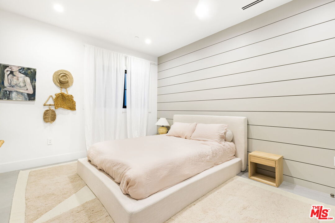 6310 Mirror Lake Drive Los Angeles, CA 90068 - Photo 25 of 34 a bedroom with a bed and a table