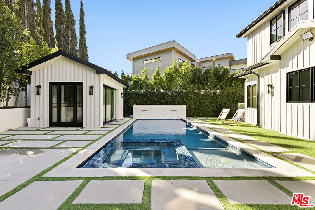 6310 Mirror Lake Drive Los Angeles, CA 90068 - Photo 31 of 34 a view of a house with a swimming pool