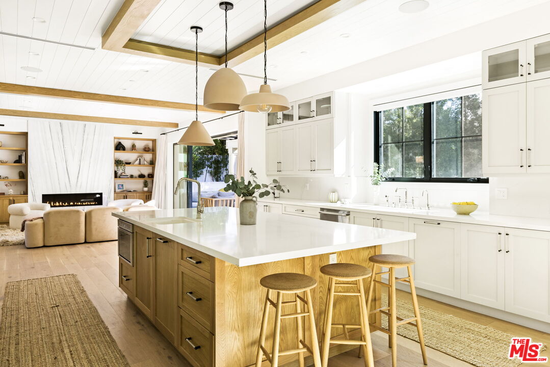 6310 Mirror Lake Drive Los Angeles, CA 90068 - Photo 8 of 34 a kitchen with a sink cabinets and window