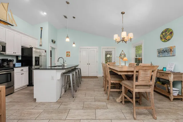 a dining room filled counter top space and stainless steel appliances