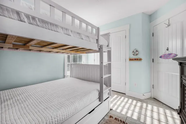 a bedroom with a bed and a walk in closet