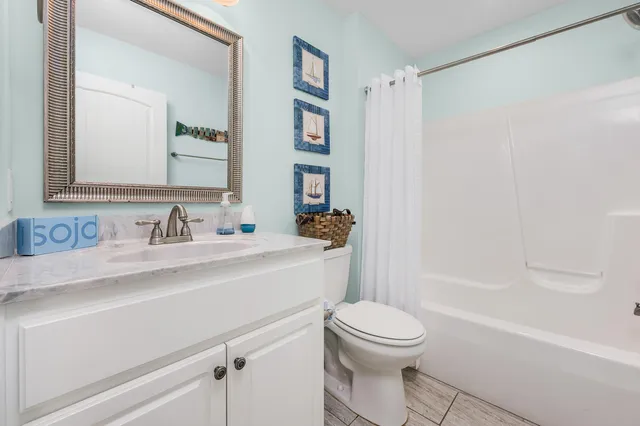a bathroom with a sink a toilet and a bathtub