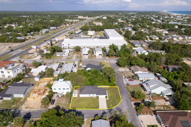 an aerial view of residential houses with outdoor space
