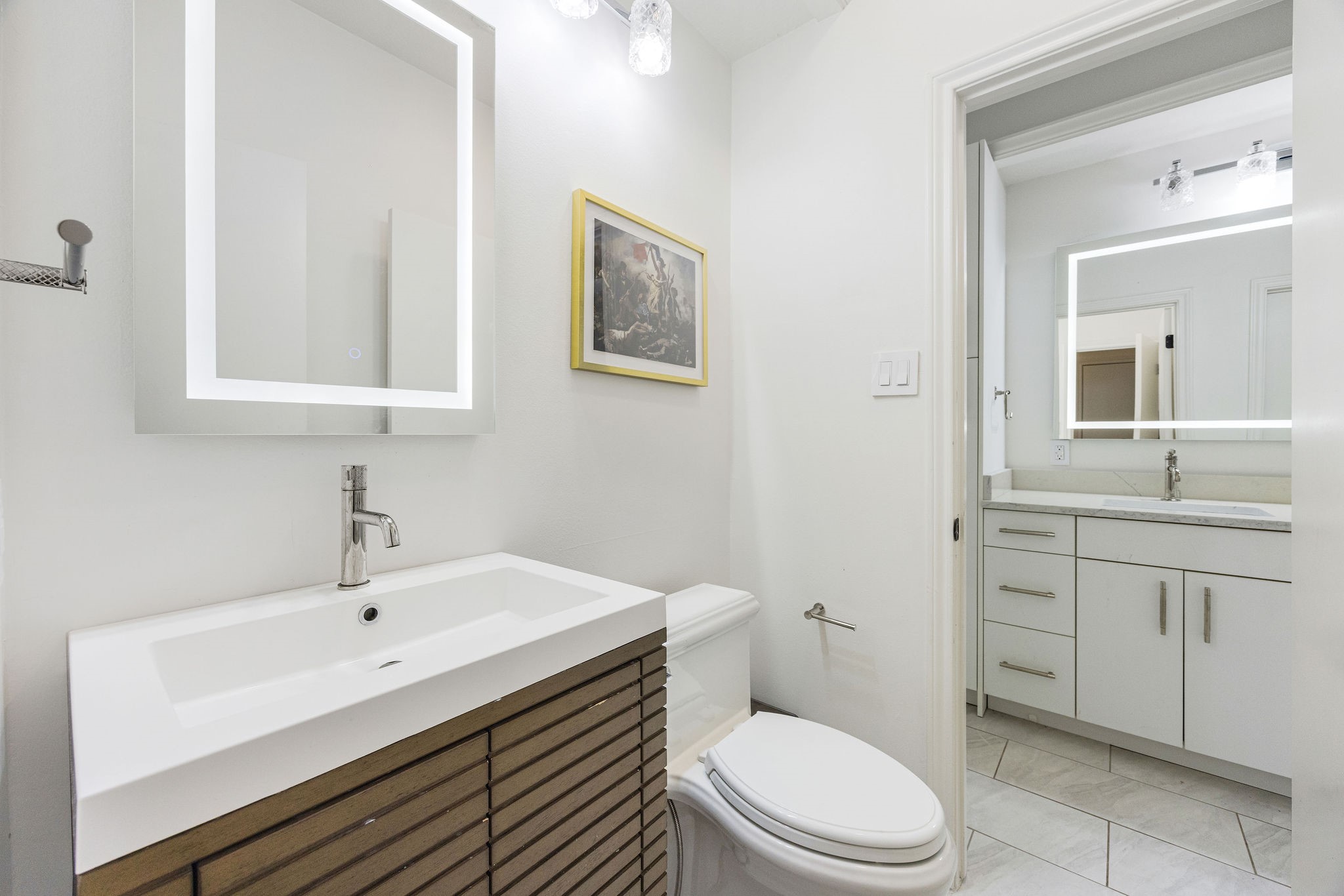 727 Bunker Hill Road, Unit 26 Houston, TX 77024 - Photo 16 of 25 This is the half bathroom located off the hallway and the perfect space for guests to use.