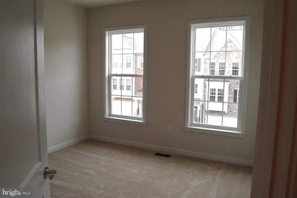 a bathroom with a toilet and a bath tub