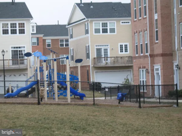 a front view of a residential apartment building with a yard