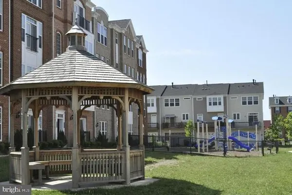 a front view of a building with parking space