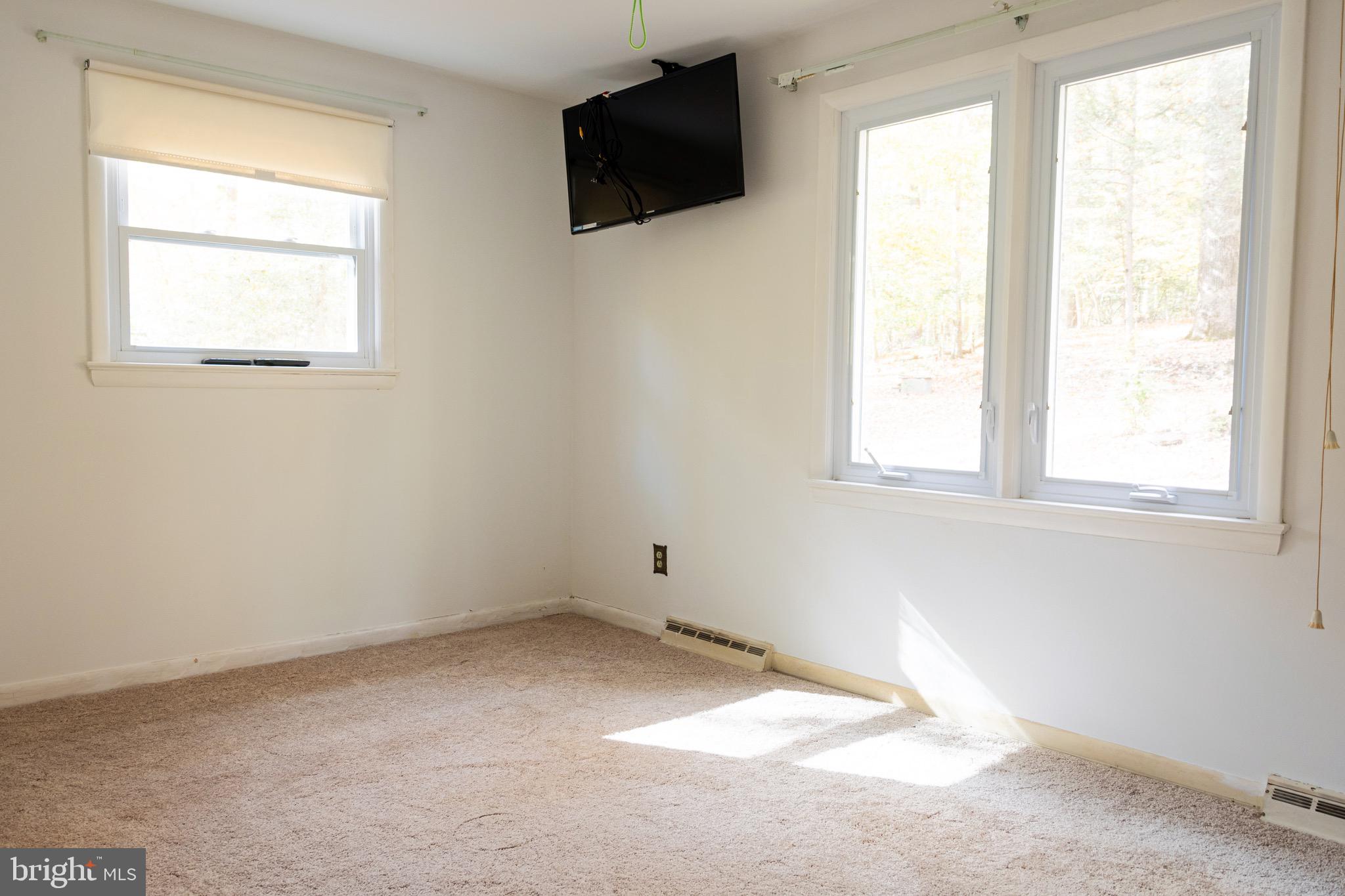 2720 Hidden Valley Road Accokeek, MD 20607 - Photo 17 of 43 an empty room with windows