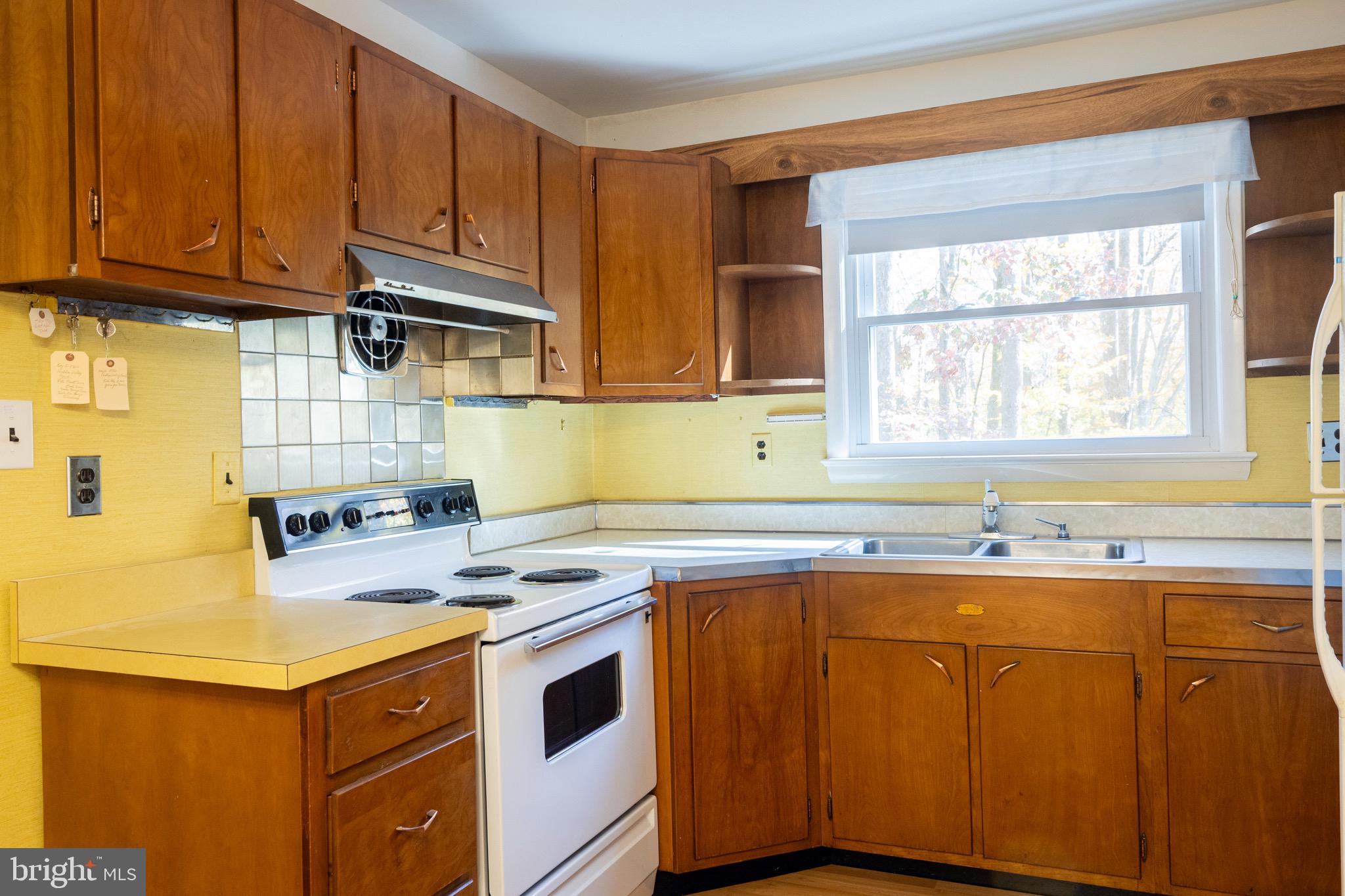 2720 Hidden Valley Road Accokeek, MD 20607 - Photo 23 of 43 a kitchen with a sink stove and cabinets