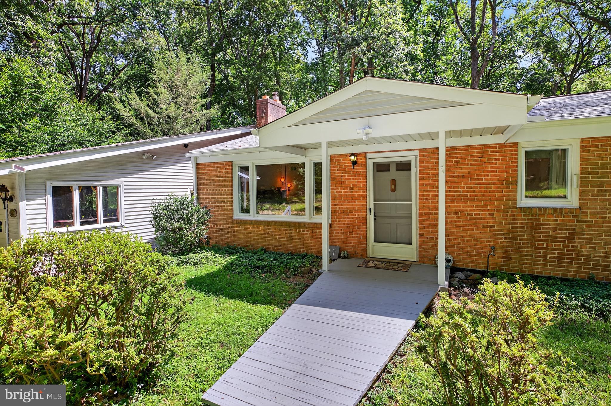 2720 Hidden Valley Road Accokeek, MD 20607 - Photo 4 of 43 a front view of a house with garden