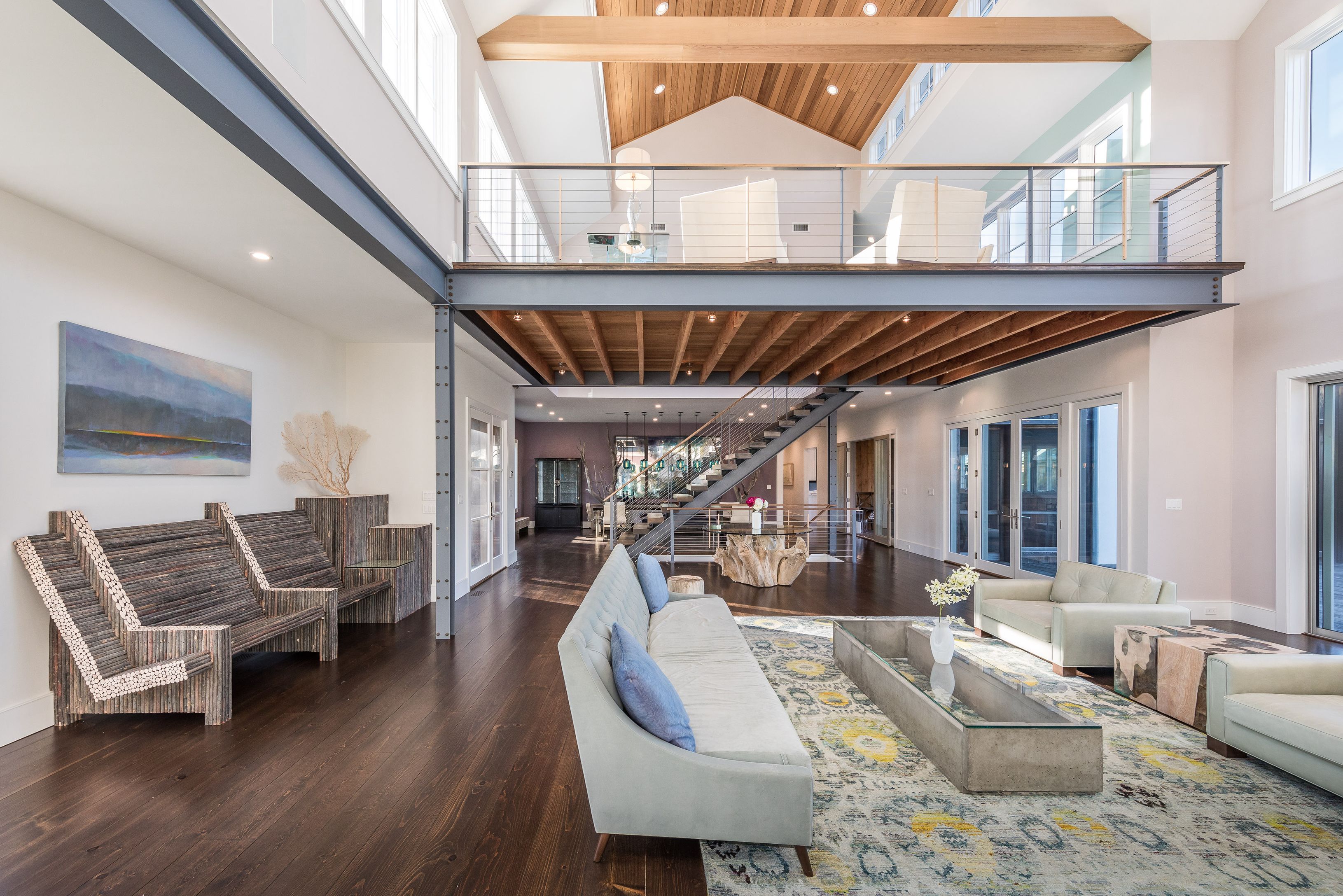 25 Jennifir Lane Bridgehampton, NY 11932 - Photo 13 of 44 a living room with furniture a couch and a chandelier