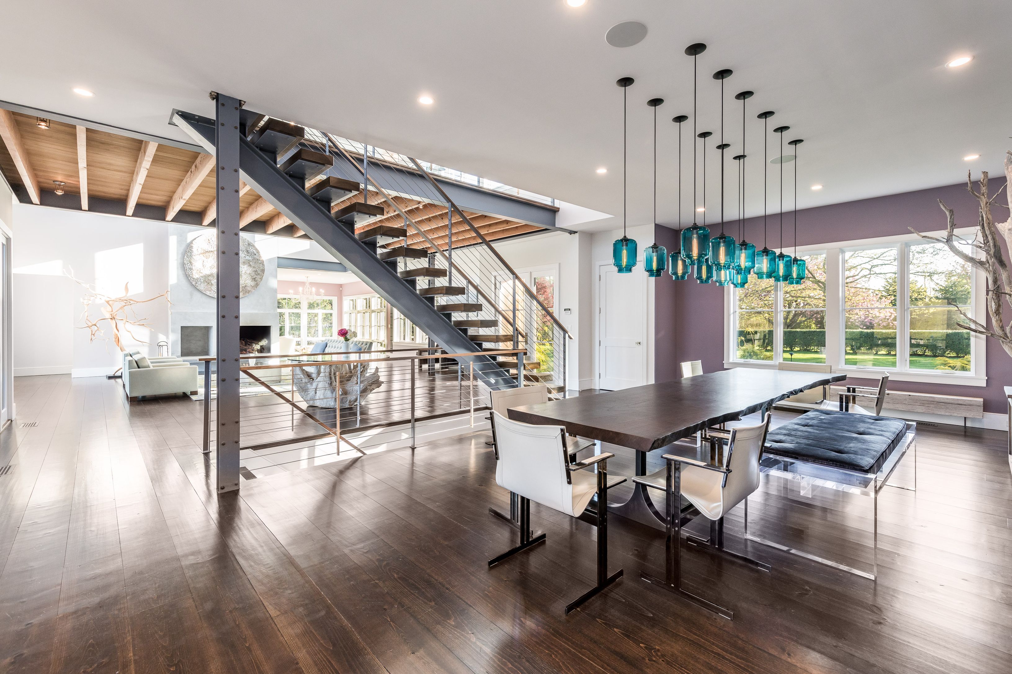 25 Jennifir Lane Bridgehampton, NY 11932 - Photo 15 of 44 a view of a livingroom with furniture wooden floor and windows