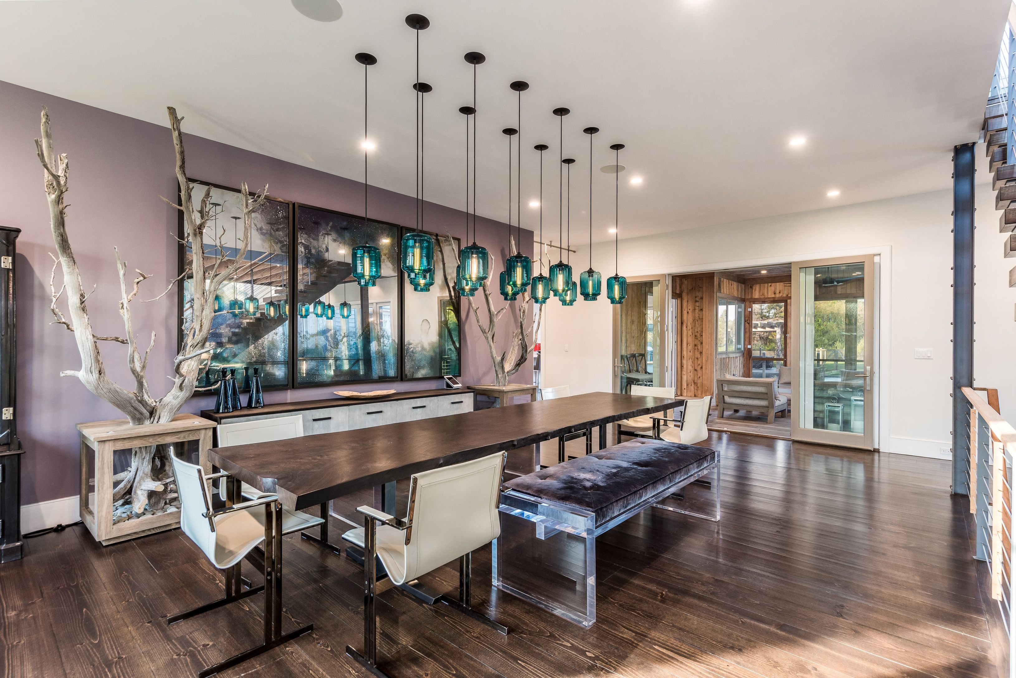25 Jennifir Lane Bridgehampton, NY 11932 - Photo 16 of 44 a living room with furniture a large window and wooden floor