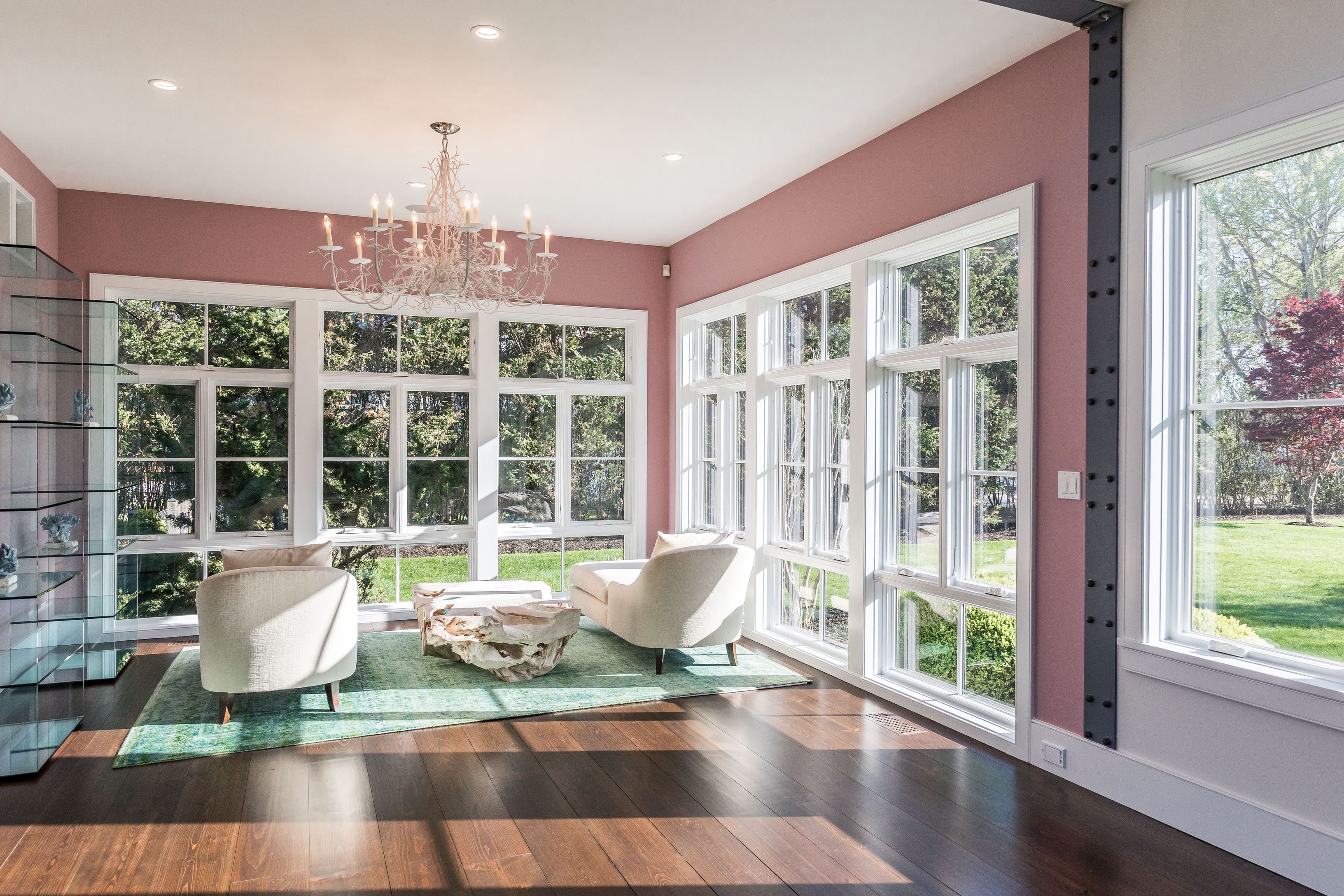 25 Jennifir Lane Bridgehampton, NY 11932 - Photo 17 of 44 a view of a dining room with furniture a chandelier and wooden floor