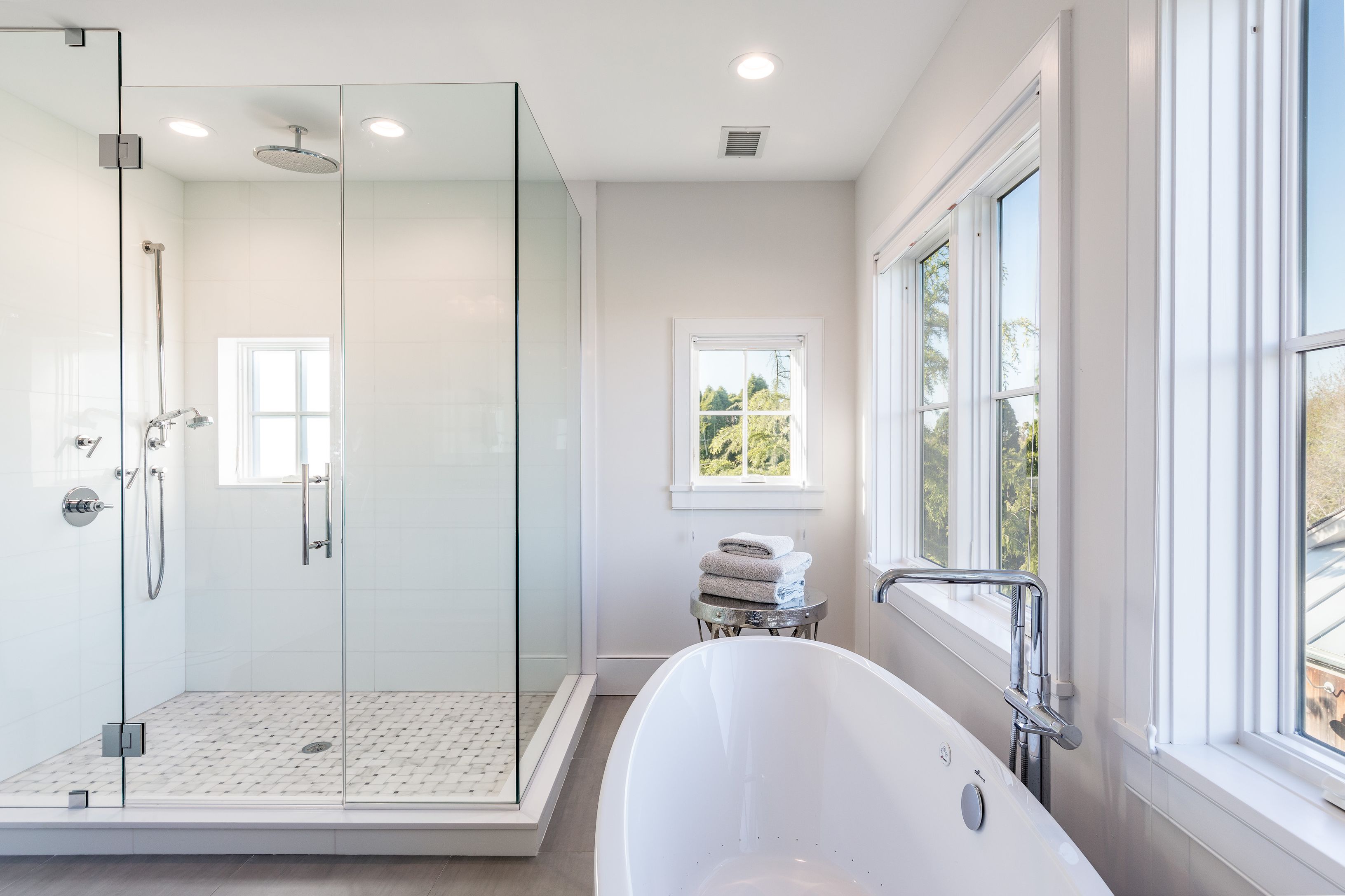 25 Jennifir Lane Bridgehampton, NY 11932 - Photo 27 of 44 a bathroom with a tub and a shower