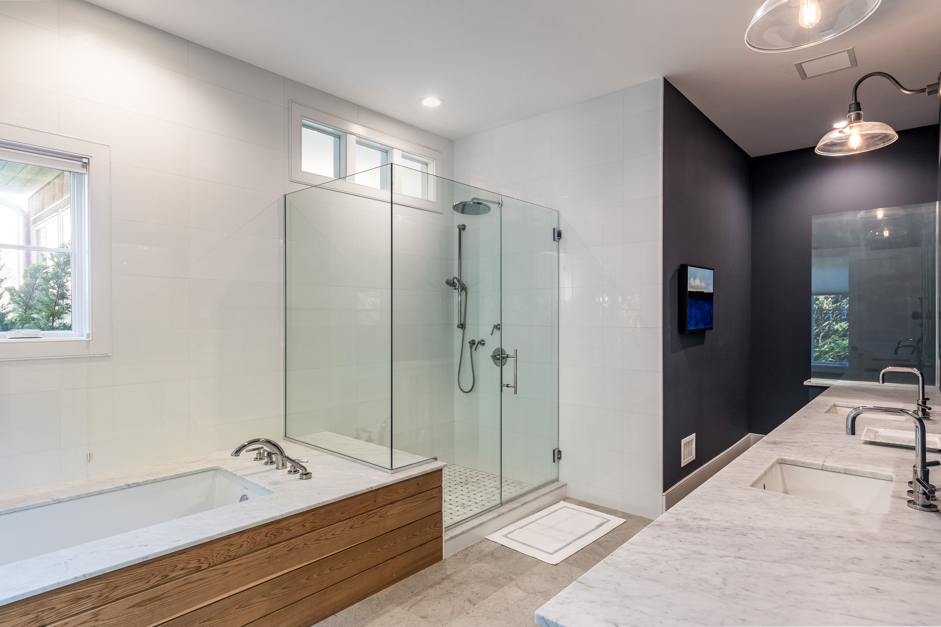 25 Jennifir Lane Bridgehampton, NY 11932 - Photo 33 of 44 a spacious bathroom with a tub and a shower