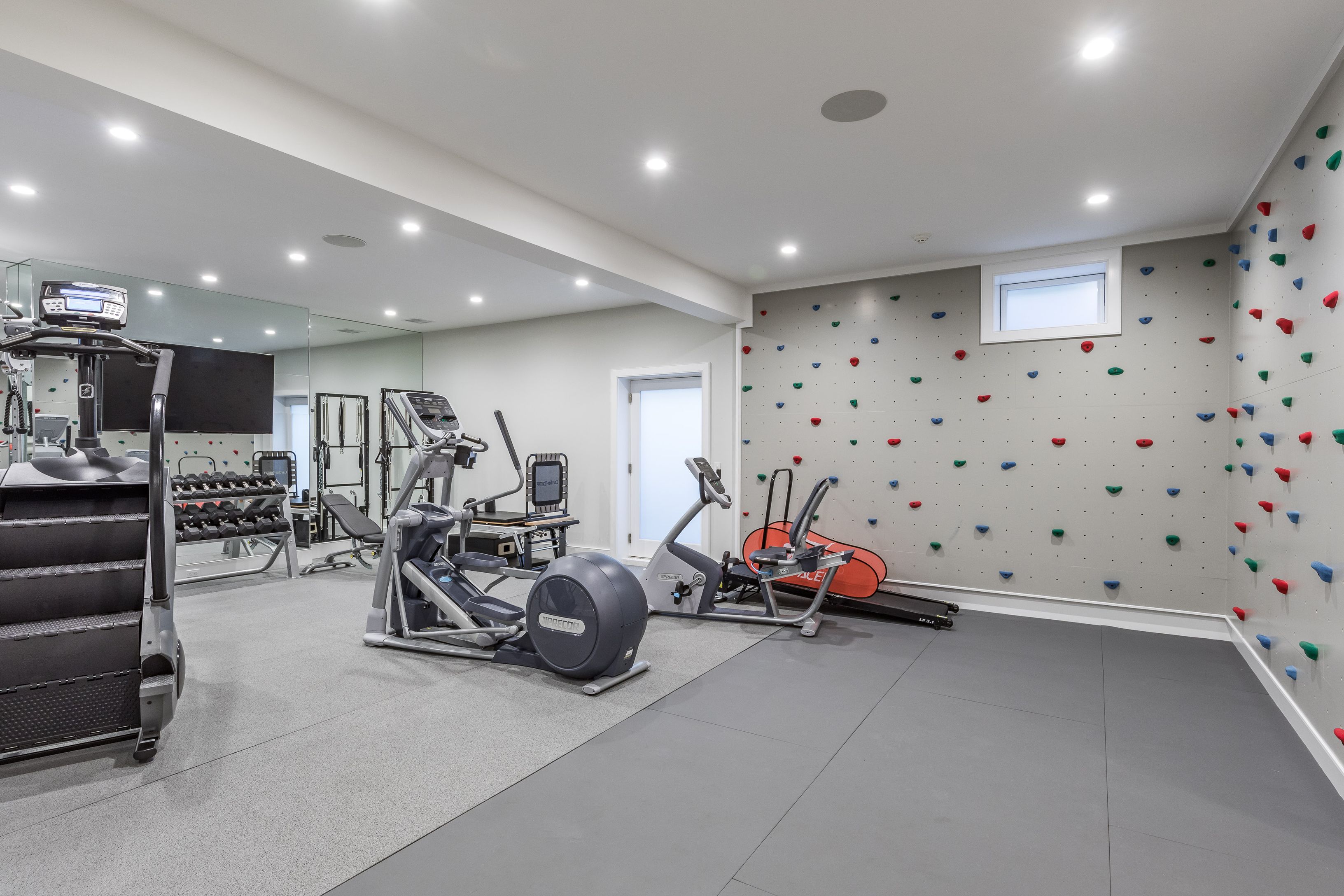 25 Jennifir Lane Bridgehampton, NY 11932 - Photo 37 of 44 a view of a room with gym equipment