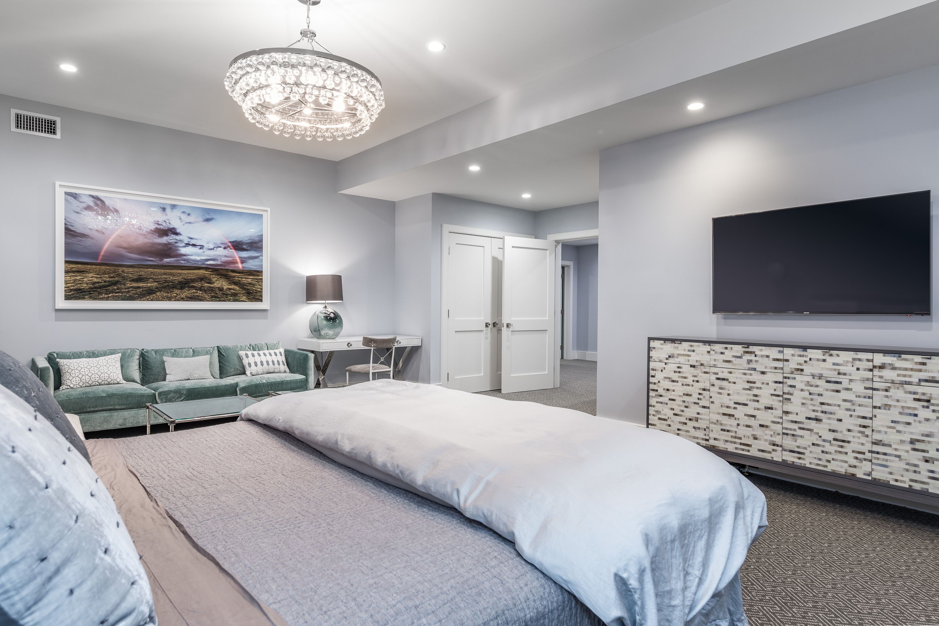 25 Jennifir Lane Bridgehampton, NY 11932 - Photo 38 of 44 a spacious bedroom with a bed and a flat screen tv