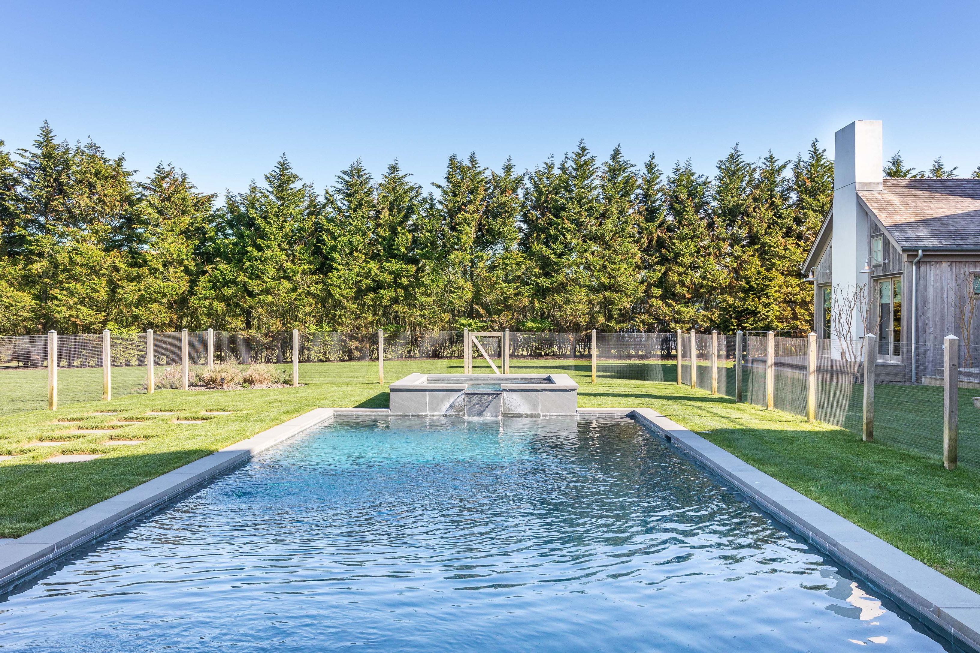 25 Jennifir Lane Bridgehampton, NY 11932 - Photo 41 of 44 a view of a swimming pool with a yard and sitting area