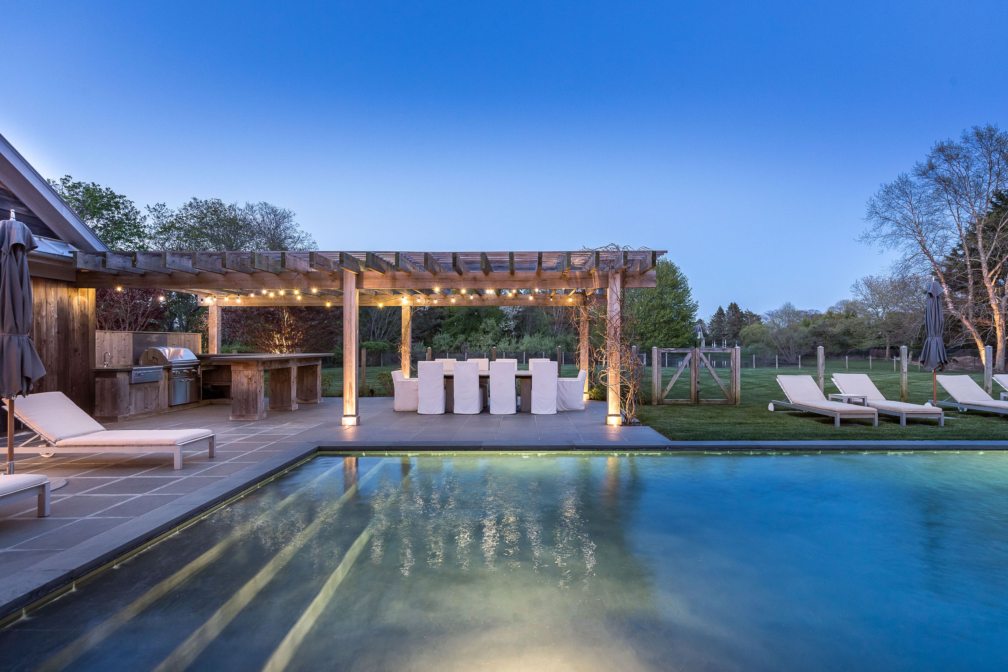 25 Jennifir Lane Bridgehampton, NY 11932 - Photo 9 of 44 a view of a swimming pool with an outdoor seating