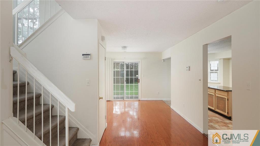 169 Nebula Road Piscataway, NJ 08854 - Photo 12 of 31 a view of a room with wooden floor and windows