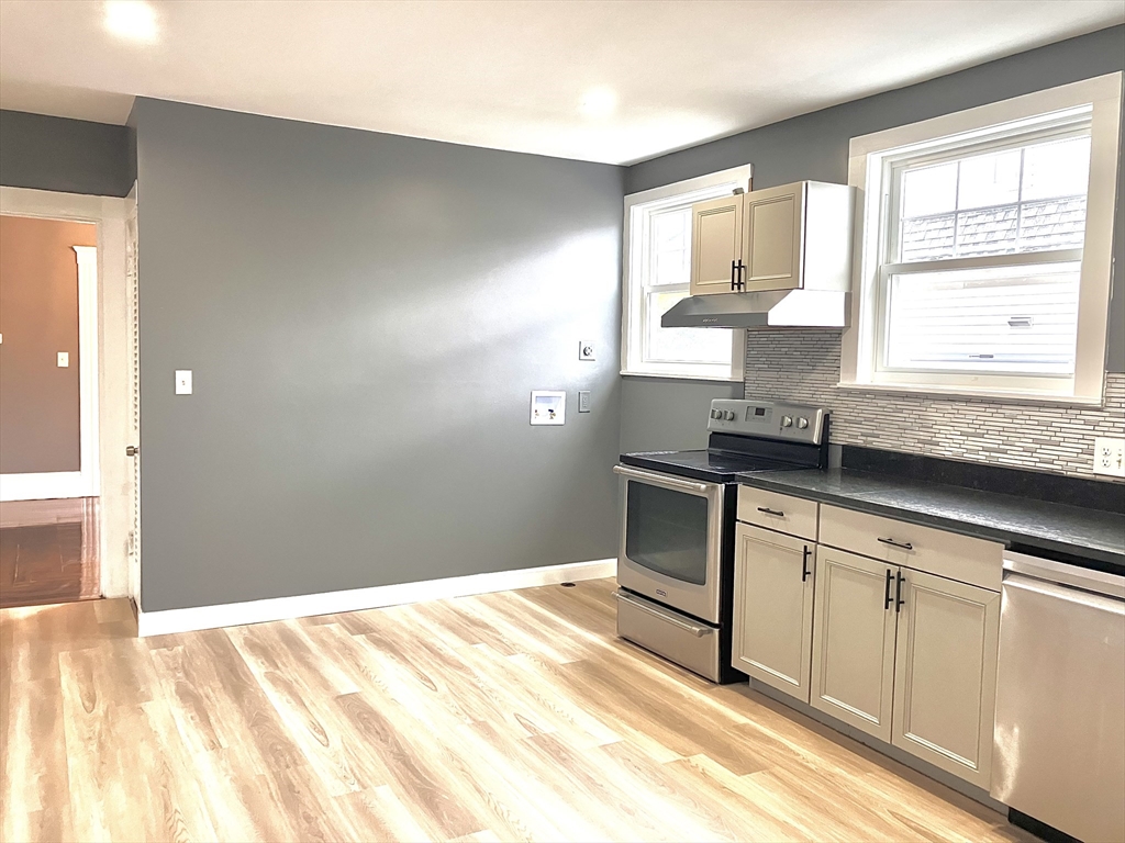 20 Sweetser Terrace, Unit 20 Lynn, MA 01904 - Photo 6 of 11 a bedroom with a bed and a window