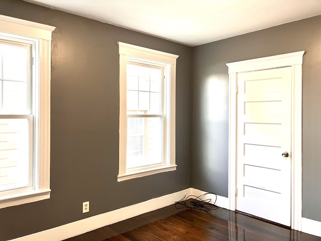 20 Sweetser Terrace, Unit 20 Lynn, MA 01904 - Photo 10 of 11 a room with a window and wooden floor
