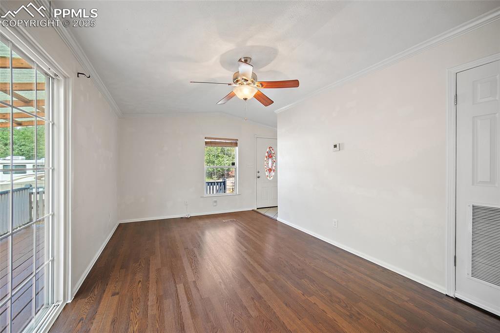 2417 West Cache La Poudre Street, Unit A & B Colorado Springs, CO 80904 - Photo 13 of 38 wooden floor in an empty room with a window