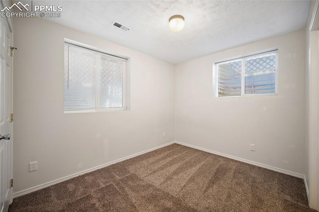 2417 West Cache La Poudre Street, Unit A & B Colorado Springs, CO 80904 - Photo 17 of 38 an empty room with a window