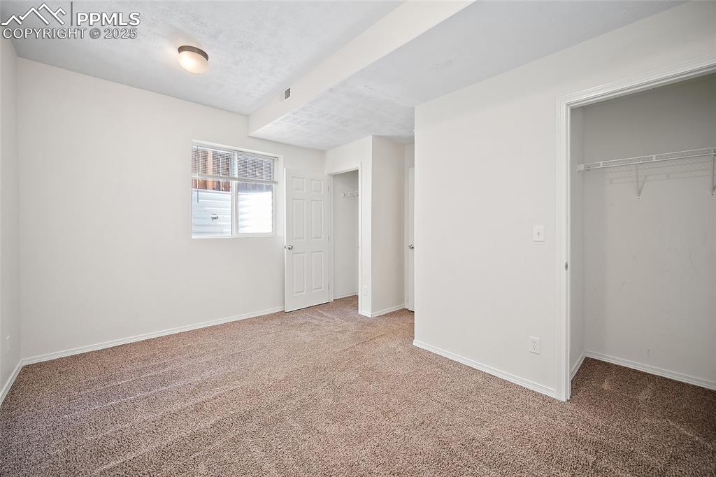 2417 West Cache La Poudre Street, Unit A & B Colorado Springs, CO 80904 - Photo 20 of 38 an empty room with windows