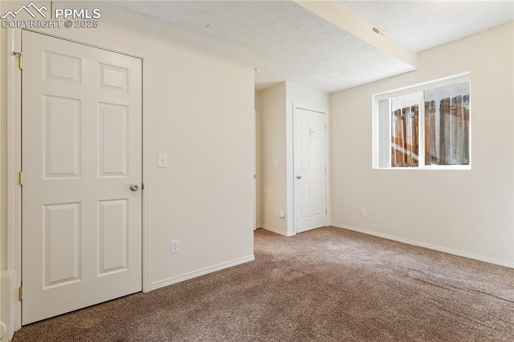 2417 West Cache La Poudre Street, Unit A & B Colorado Springs, CO 80904 - Photo 30 of 38 an empty room with windows