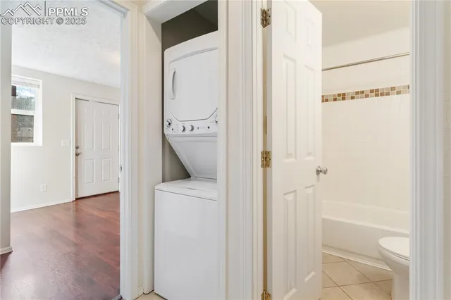 a view of hallway with wooden floor