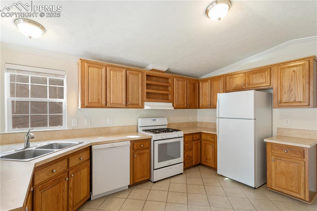 2417 West Cache La Poudre Street, Unit A & B Colorado Springs, CO 80904 - Photo 34 of 38 a kitchen with a stove sink and refrigerator