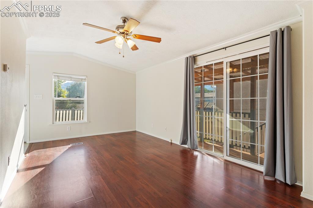2417 West Cache La Poudre Street, Unit A & B Colorado Springs, CO 80904 - Photo 38 of 38 a view of an empty room with wooden floor and a window