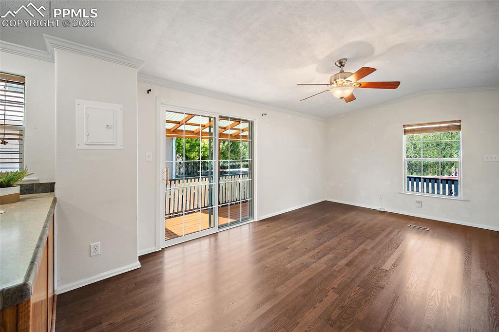 2417 West Cache La Poudre Street, Unit A & B Colorado Springs, CO 80904 - Photo 6 of 38 a view of an empty room with wooden floor and a window