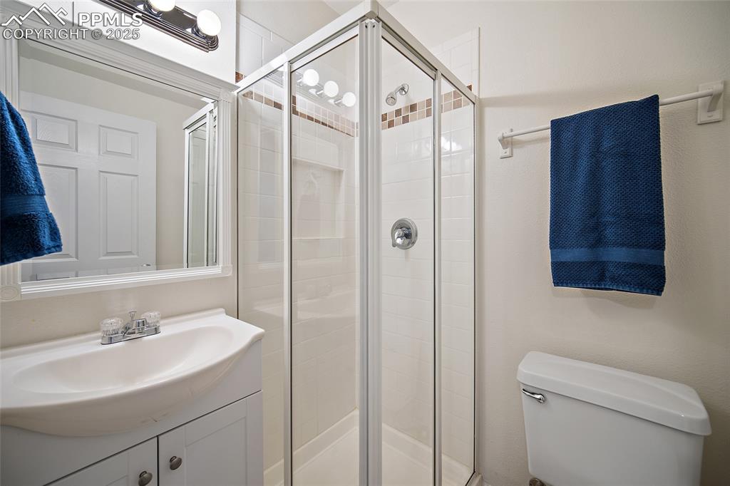 2417 West Cache La Poudre Street, Unit A & B Colorado Springs, CO 80904 - Photo 10 of 38 a bathroom with a sink a toilet and shower