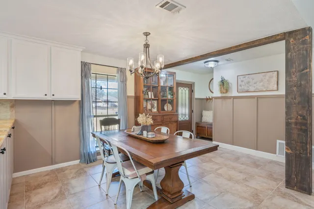 a kitchen with cabinets a sink and white stainless steel appliances