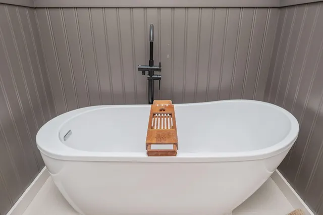 a bathroom with a glass shower door