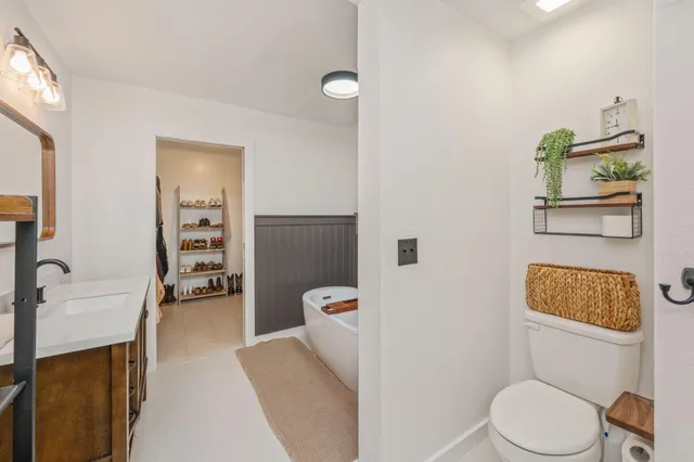 a bedroom with a bed and a table in it