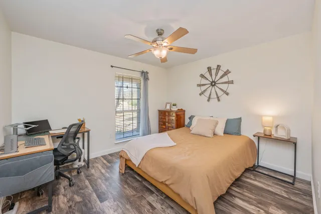 a bedroom with a bed and cabinets