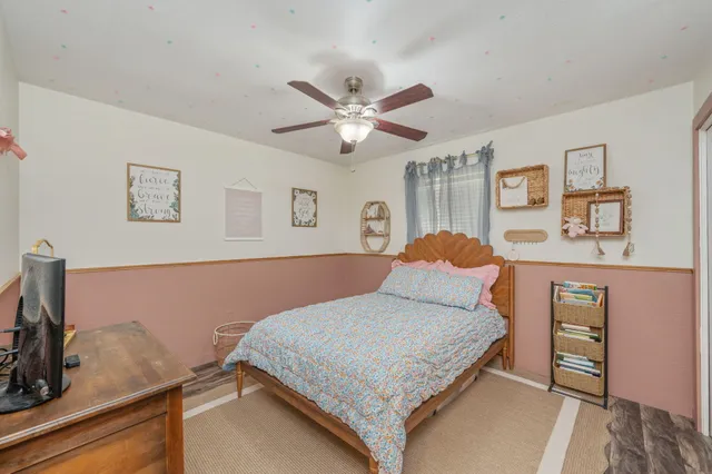 a bathroom with a sink a toilet and shower curtain