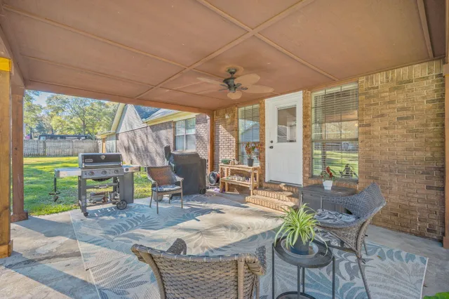 a view of a field with trees around