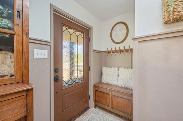 a kitchen with stainless steel appliances cabinets and window