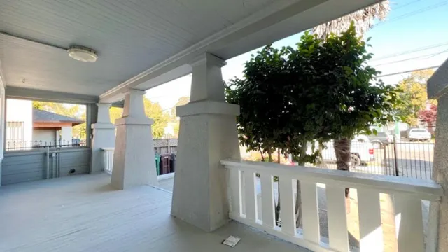 a view of a glass door with a yard