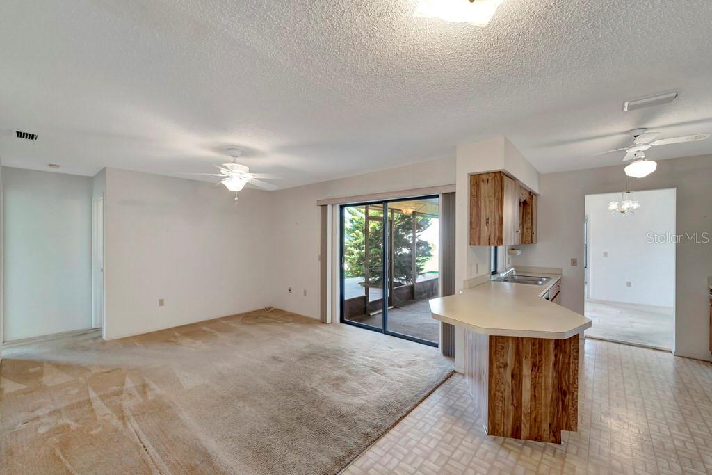 5861 Adams Road Venice, FL 34293 - Photo 11 of 51 Family Room has a Sliding Door to the Lanai