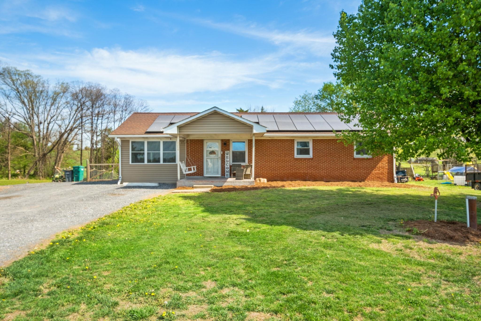 8208 George Wine Road Bridgewater, VA 22812 - Photo 1 of 27 a view of a house with a backyard