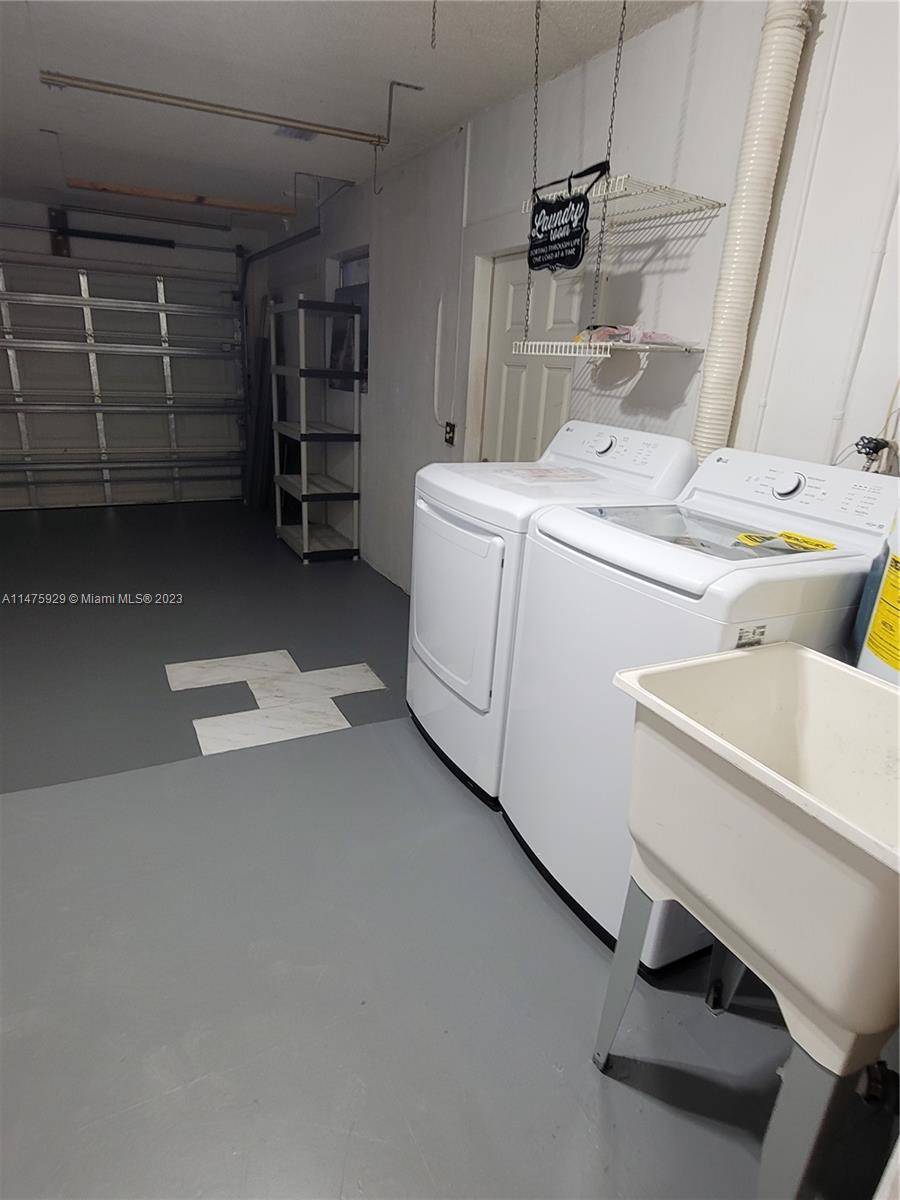 22780 Family Circle Boca Raton, FL 33428 - Photo 12 of 19 a utility room with dryer and washer