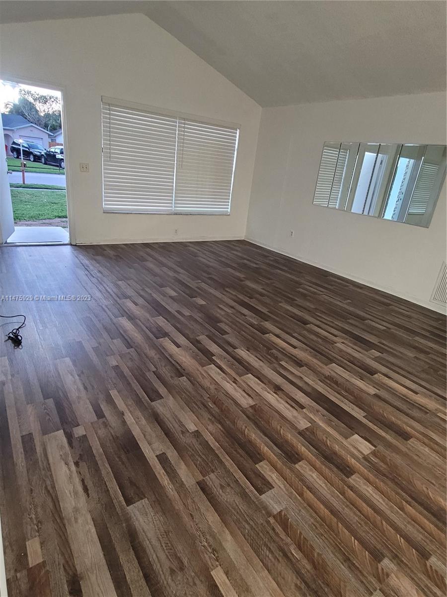 22780 Family Circle Boca Raton, FL 33428 - Photo 13 of 19 a view of a room with wooden floor