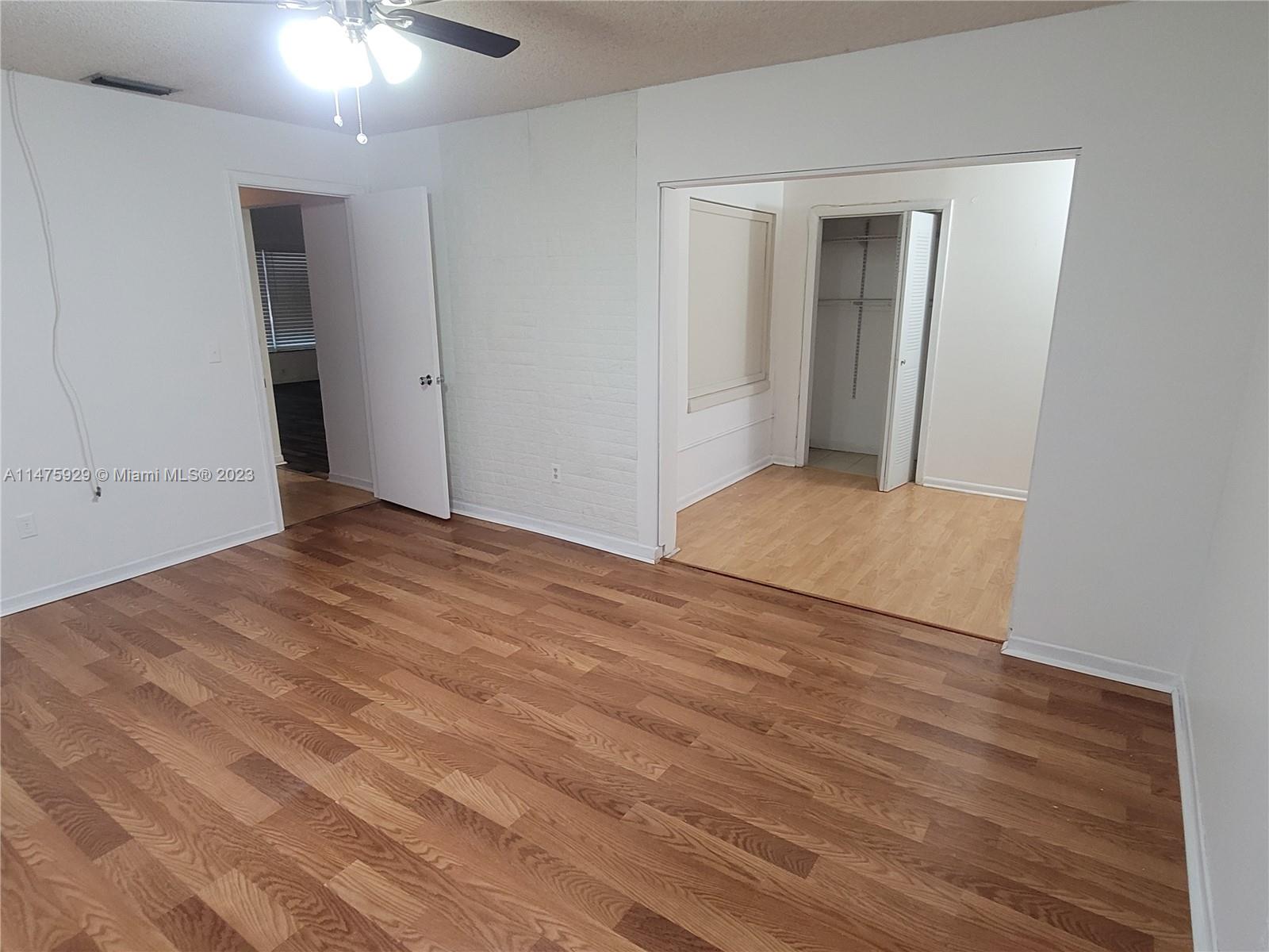 22780 Family Circle Boca Raton, FL 33428 - Photo 14 of 19 a view of empty room with wooden floor